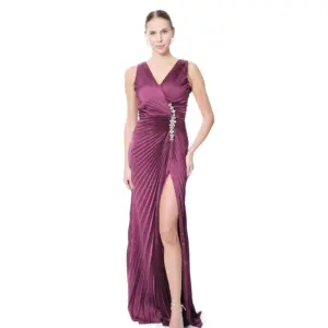 Long pleated evening dress with crystal waist detail