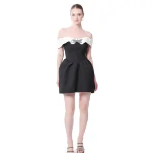 Off shoulder cocktail dress with bow detail and pleated two-tone design