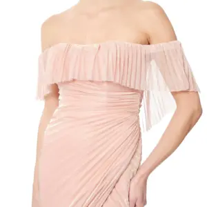 Off shoulder gown pleated with sheer overlay