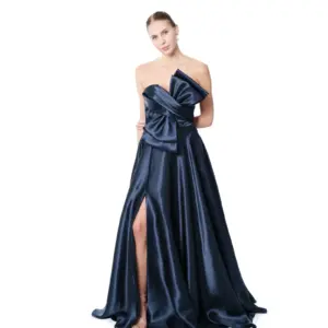 Strapless long evening gown with bow accent and high slit